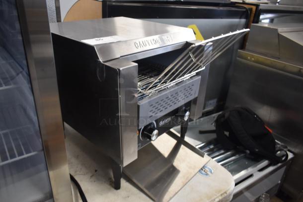 Galaxy conveyor toaster, stainless steel, dual controls, "Caution Hot" label, used condition, visible wear.