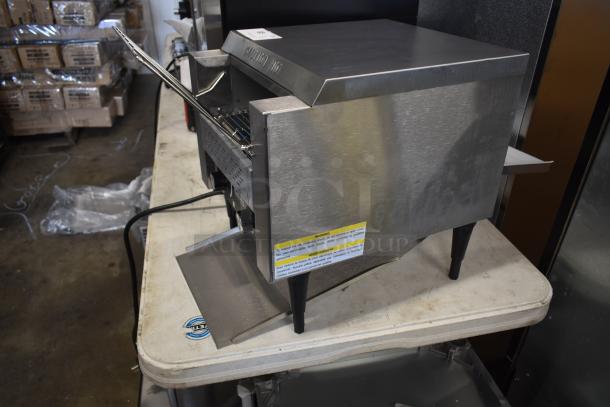 Commercial countertop conveyor toaster, stainless steel, "Caution Hot" label, warning label, used condition.