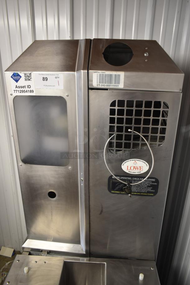 Stainless steel control tower with vents and service label from Lowe. Visible tags include asset ID 7712954189 and barcode CT-242-000119401.