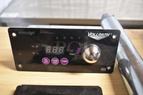 Vollrath Mirage induction cooktop control panel with digital display, timer, and stainless knob in used condition.