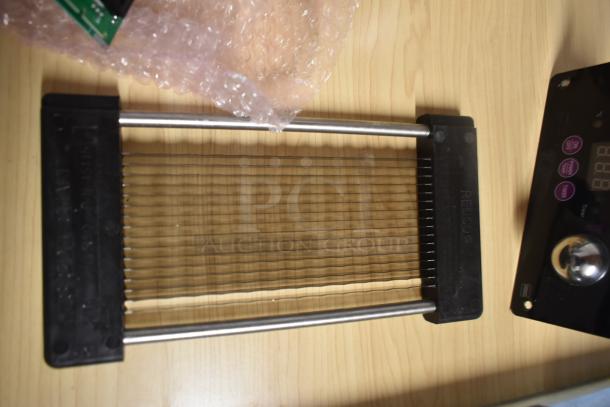 Redco slicer blade assembly with grid pattern, steel rods, and black plastic frame, for food preparation.