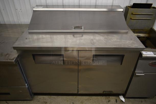 Stainless steel commercial sandwich prep table with dual doors, Superior label, handle on top; ideal for foodservice use.