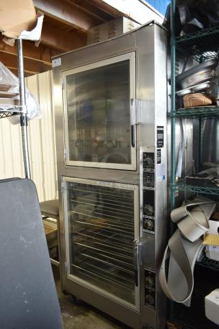 Commercial stainless steel oven with dual glass doors, multiple shelves, control panel with knobs, labeled "Caution Hot."