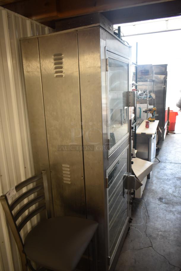 Commercial stainless steel oven with glass door, used condition, visible vents, no visible markings or labels.
