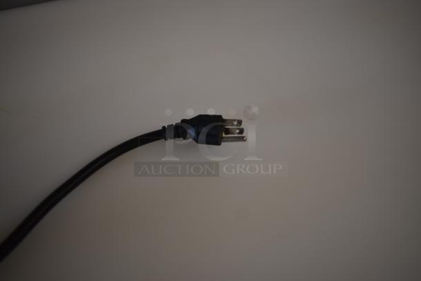 Black three-prong power cord, standard US plug, minimal wear, suitable for electronic devices.