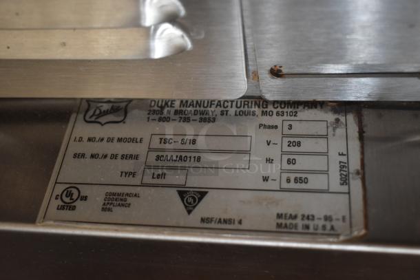 Duke Manufacturing appliance label, model TSC-6/18, serial 30AAJA0118, 208V, 3-phase, commercial cooking appliance, US-made.