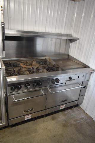 Vulcan commercial gas stove with six burners, griddle, dual ovens, stainless steel finish, minor wear; model label visible.