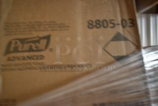 Blurred cardboard box labeled "Purell Advanced" and "8805-03," partially wrapped in plastic.