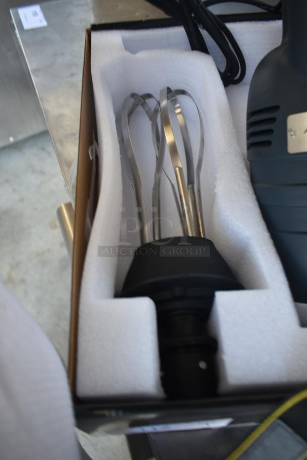 Commercial stand mixer paddle attachment in packaging. Stainless steel, brand new, with protective foam insert.