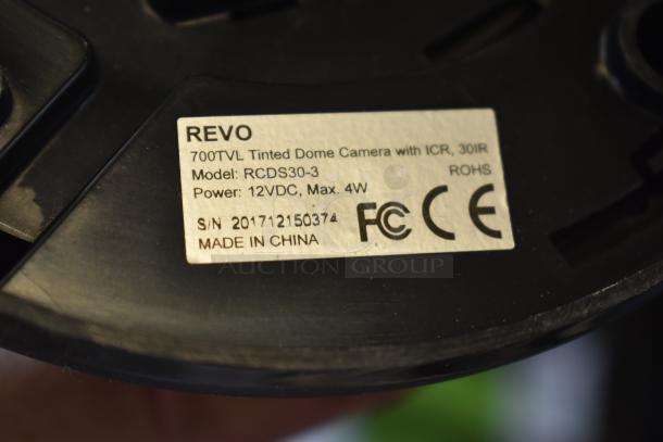 Revo 700TVL Tinted Dome Camera, model RCDS30-3. Power: 12VDC, Max 4W. Features ICR, 30IR. Made in China. FCC, ROHS compliant.