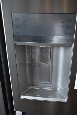 Stainless steel refrigerator water and ice dispenser panel with controls for water, cube, and crush options, in good condition.