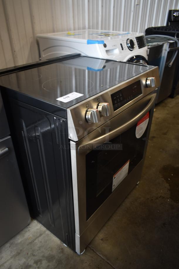 Stainless steel electric oven with digital controls, smooth cooktop, auction tag "119," in excellent condition.
