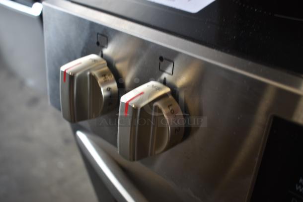 Stainless steel stove control knobs, showing temperature settings from Lo to Hi, in excellent condition.