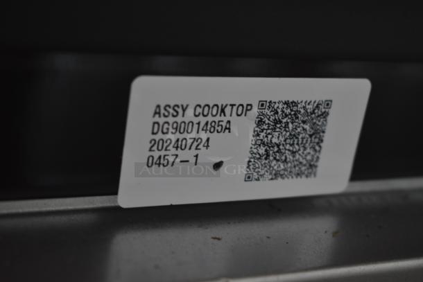 Cooktop assembly label, model DG9001485A, dated 20240724, includes a QR code.