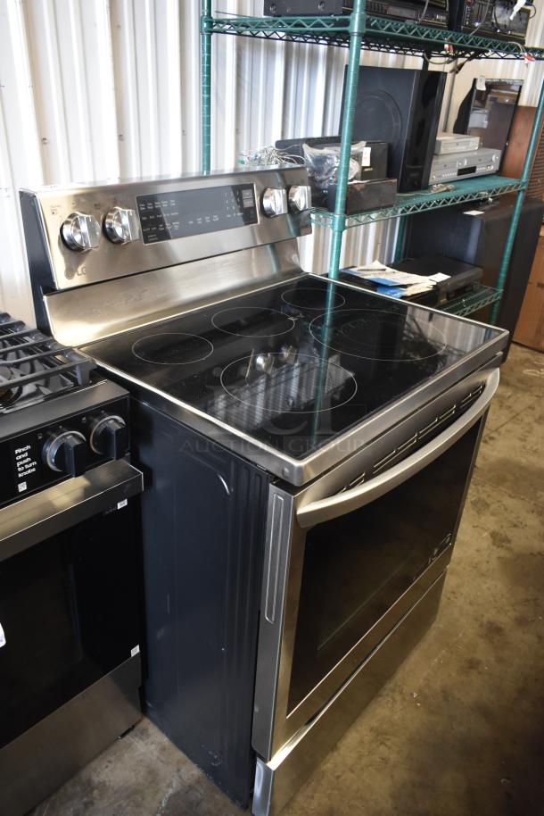 LG stainless steel electric range with glass cooktop, five burners, and digital controls in excellent condition.