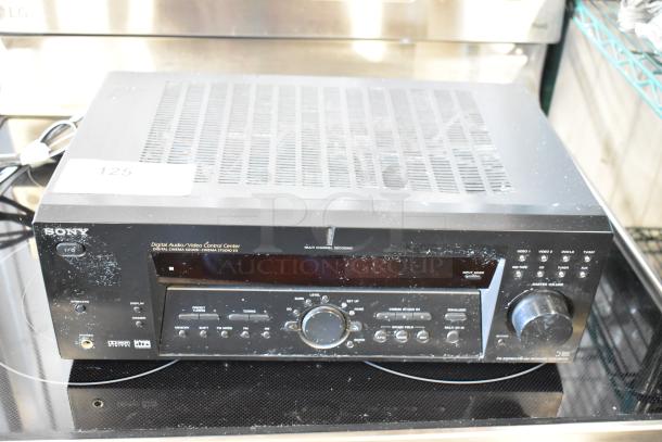 Sony digital audio/video control center with multi-channel decoding. Features volume knob, input modes, signs of wear. Model: STR-K660P.