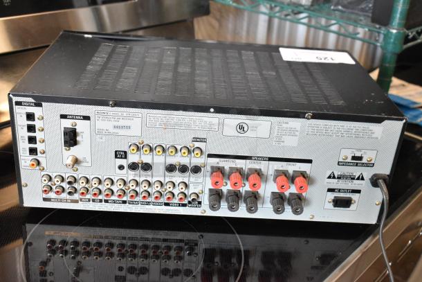 Sony STR-DE675 FM Stereo/FM-AM Receiver, multiple audio input/output ports, speaker terminals, in used condition.