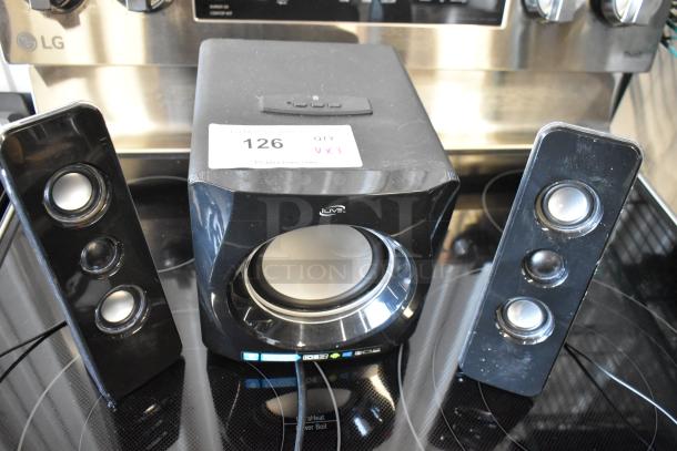 iLive speaker system with subwoofer and two satellite speakers. Black finish, good condition. Label: "126 QTY VX3."