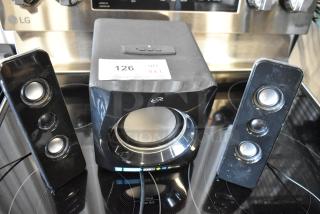 iLive speaker system with subwoofer and two satellite speakers. Black finish, good condition. Label: "126 QTY VX3."