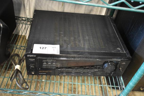 Sony FM Stereo/FM-AM Receiver STR-DE505, black, with power cord. Visible wear on casing. Auction label "127" attached.