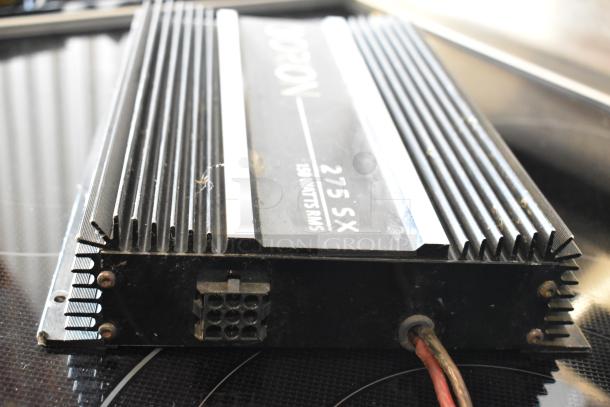 Vintage car amplifier Orbion 275 SX, 150 watts RMS, black with fins, used condition, visible wiring port.