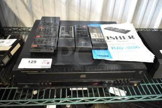 Harman Kardon FL8300 CD player with multiple remote controls and a Fisher RAV-886 manual. Auction item 129.