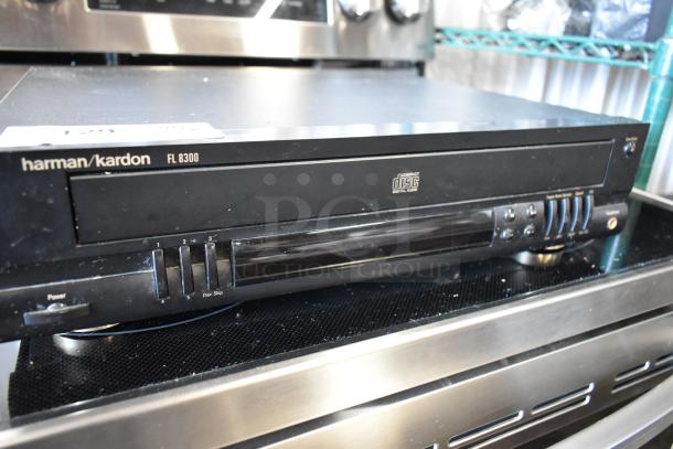 Harman Kardon FL 8300 CD changer, black, visible wear, five-disc capacity, front panel controls, labeled for Compact Disc Digital Audio.