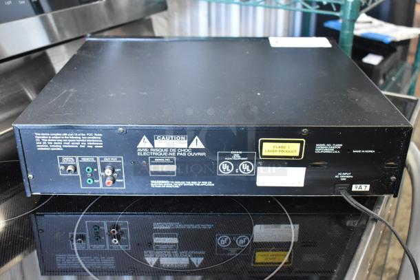 Harman Kardon FL8300 CD player, black, with digital/analog outputs, Class 1 laser product label, and minor surface wear.