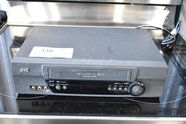 JVC Pro-Cision VHS player, model HR-A57U, with 19μ head, Hi-Fi audio, visible tape slot, and connectivity ports.