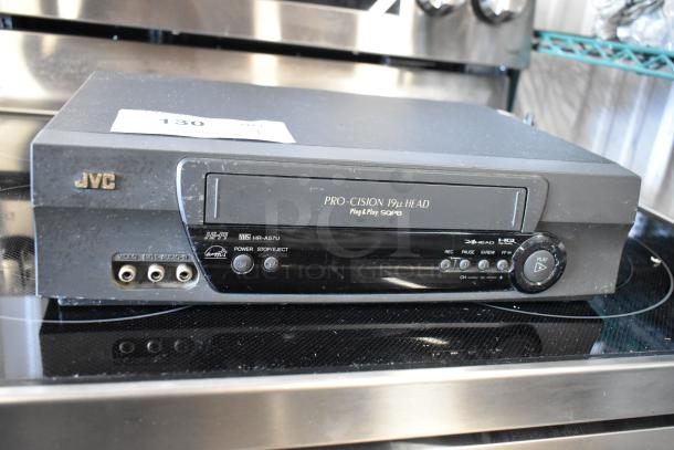 JVC VHS player, model HR-A57U, Pro-Cision 19u Head, Hi-Fi, front audio/video inputs, minor wear, auction number tag on top.