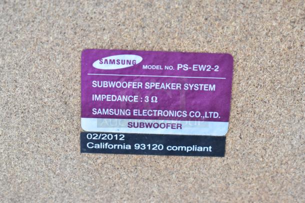 Samsung subwoofer label, model PS-EW2-2, impedance 3 ohms, made 02/2012, California 93120 compliant.