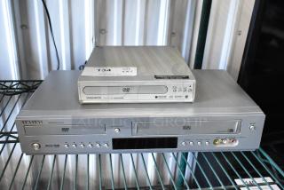Samsung DVD-V5500 DVD/VHS player and Magnavox MWD200GA DVD player on shelf. Both in good condition with visible labels.