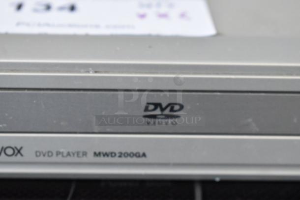Silver Magnavox DVD player MWD200GA with DVD Video logo, showing slight surface wear.