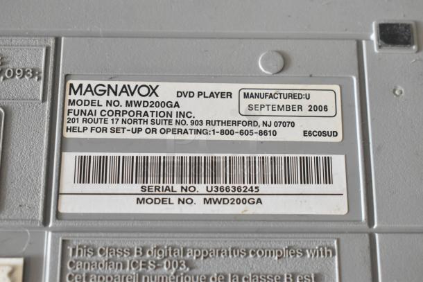 Close-up of a Magnavox DVD player label, model MWD200GA. Manufactured September 2006 by Funai Corporation. Serial number U36636245.