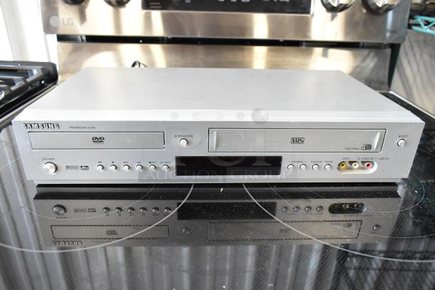 Samsung DVD-V3500 VHS DVD combo player, silver finish, with control buttons and AV inputs; gently used condition.