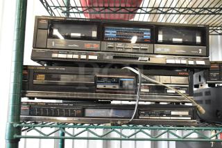 Vintage Fisher stereo system with cassette deck, CD player, and AM/FM tuner. Features include dual tape decks, digital audio, and synthesizer tuning.