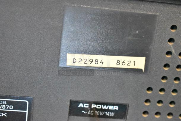 Close-up of a device with a label "D22984 8621" and "AC Power ~ AC 16V/14W," showing model number and power specs.