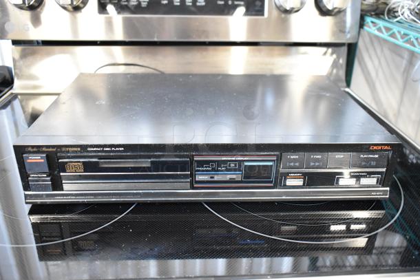 Vintage Fisher AD-870 CD player, front panel controls, digital display, minor surface wear, compact disc loading tray.