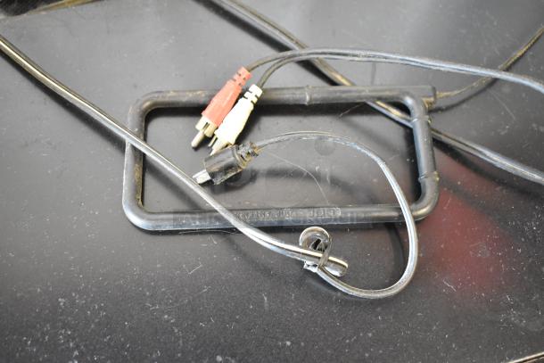 Black loop antenna with attached audio cables, including RCA connectors. "ROG 14 ANTENNA" marking visible. Good condition.