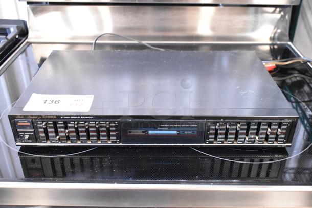 Fisher stereo graphic equalizer, model EQ-927. Multiple frequency sliders, labeled. Item tag: 136. Good condition.