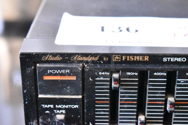 Fisher Studio Standard stereo equalizer, black, visible power button and frequency sliders, slight wear.