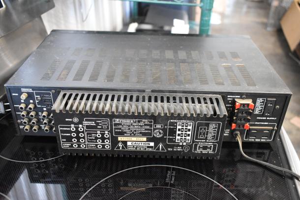 Fisher stereo amplifier, model CA-880, with rear panel connection ports and labels visible, showing signs of wear.