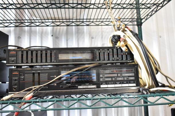 Vintage Fisher stereo graphic equalizer and amplifier set with control dials, power level display, and assorted cables.