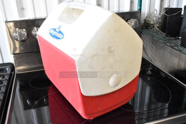 Red and white Playmate cooler, vintage design, carries visible wear, features top handle and side button; logo on top.