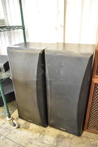 Pair of Infinity floor speakers, black finish, with visible wear on corners; model details not specified.