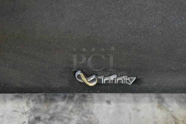 Infinity speaker logo on black fabric grill, indicating brand authenticity.