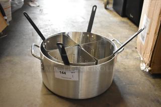 Stainless steel pasta cooker with four dividers, black handles, and visible auction label. Excellent condition.