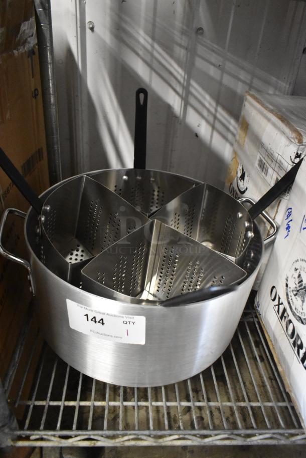 Stainless steel pasta cooker with four partitioned inserts, in excellent condition. Label reads "144 QTY 1" from PCAuctions.com.