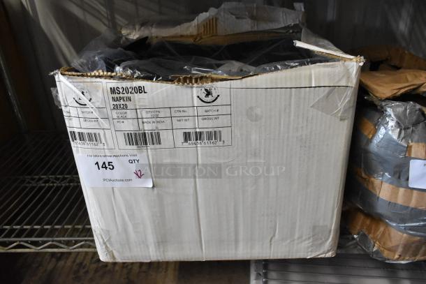 Cardboard box labeled "MS2020BL Napkin 20x20" containing black napkins, 12 per carton, made in India, auction tag "145."