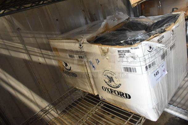 Box of Oxford black napkins, 20x20 inches, item code MS2020BL. Slightly damaged packaging, visible labels with product details.